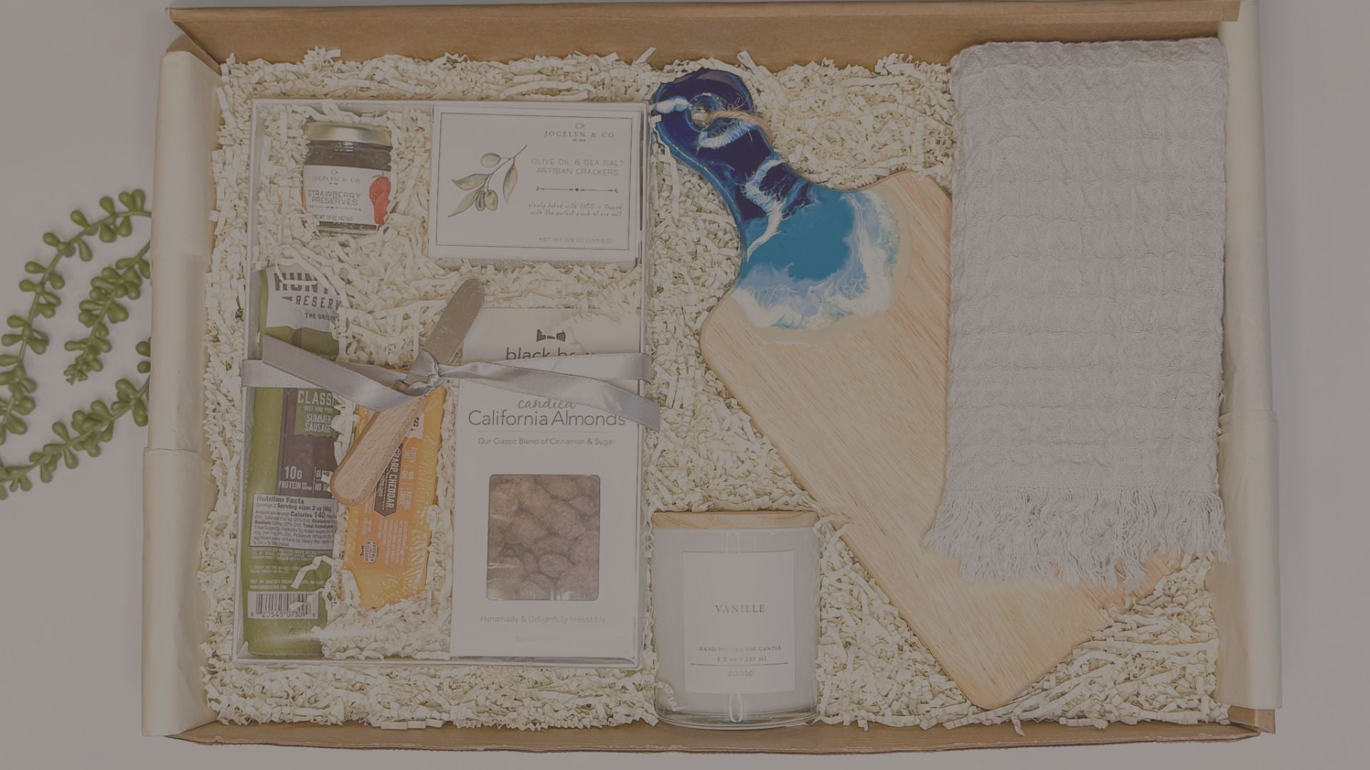 Curated Gift Basket visual with cutting board and cheese