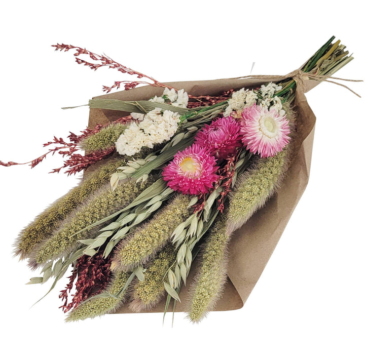 Bouquet of flowers wrapped in brown paper on a white background