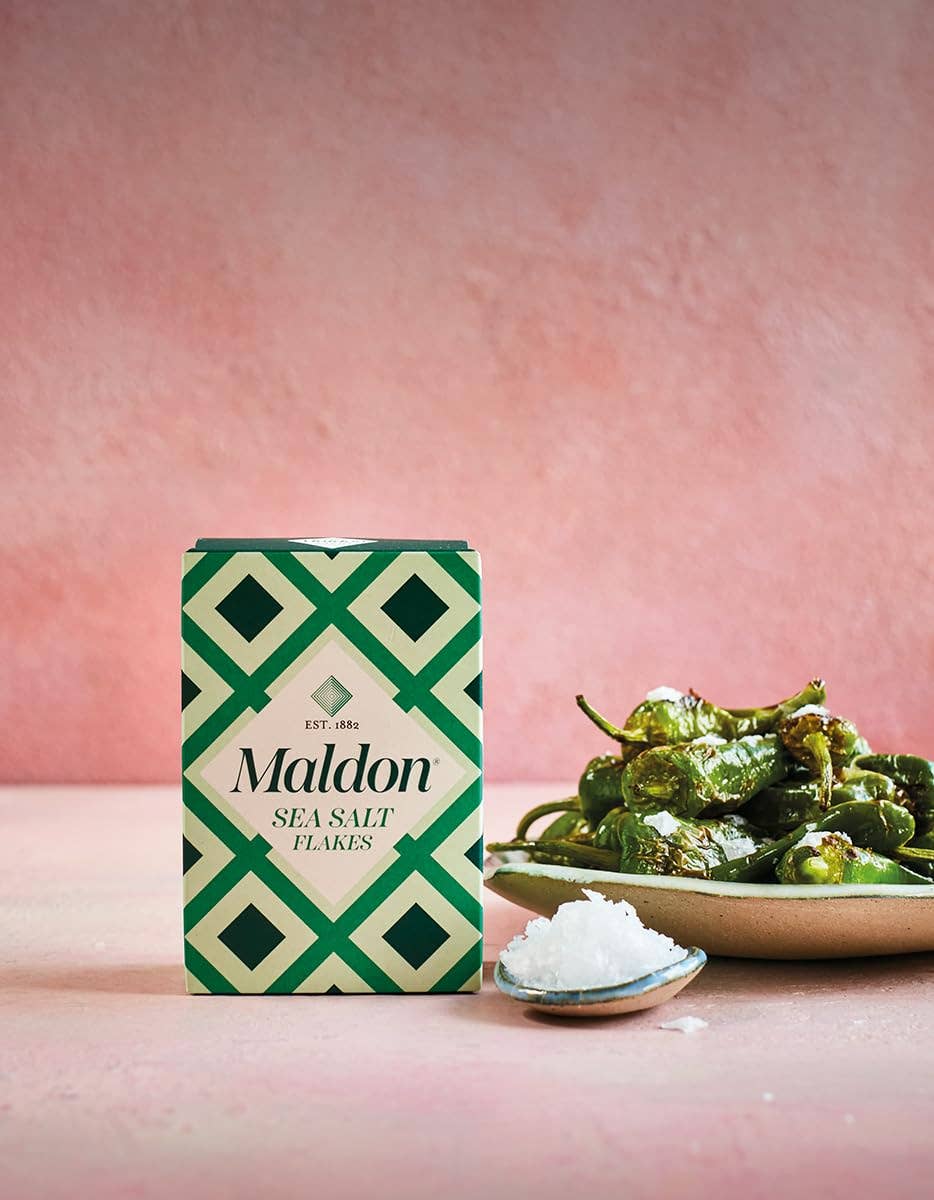 Maldon sea salt flakes packaging with a pink background