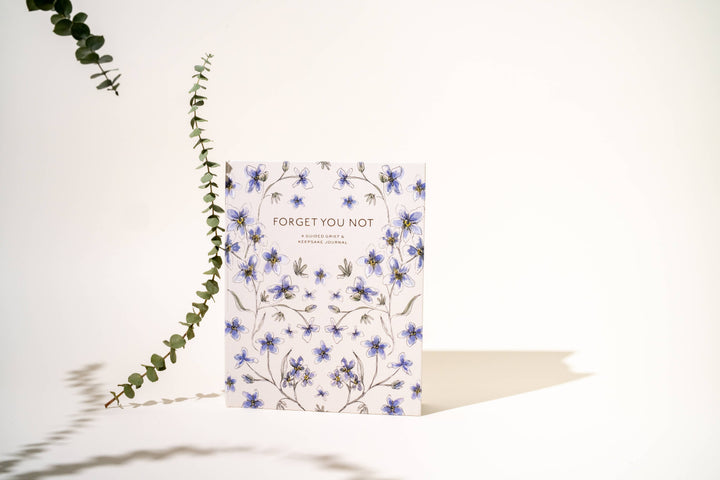 Guided journal with floral design and &