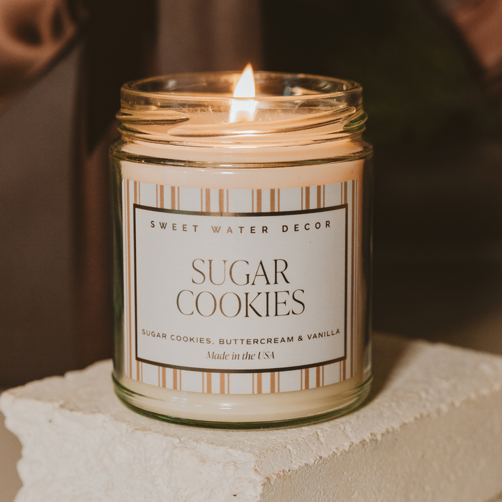 Candle in a jar labeled &