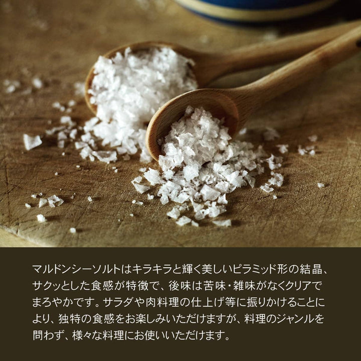 Wooden spoons filled with salt on a wooden surface