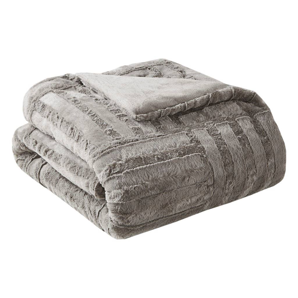 Folded gray textured blanket on a white background