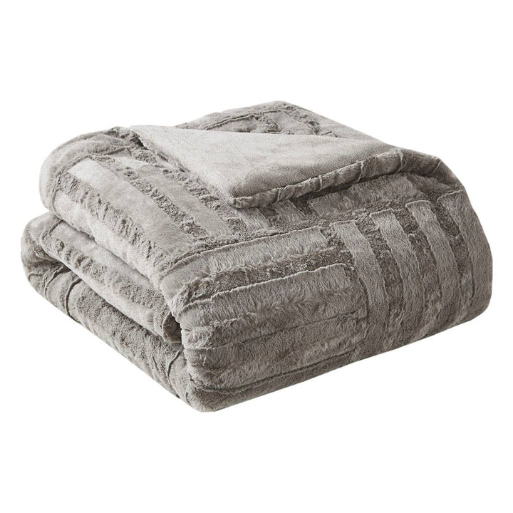 Folded gray textured blanket on a white background