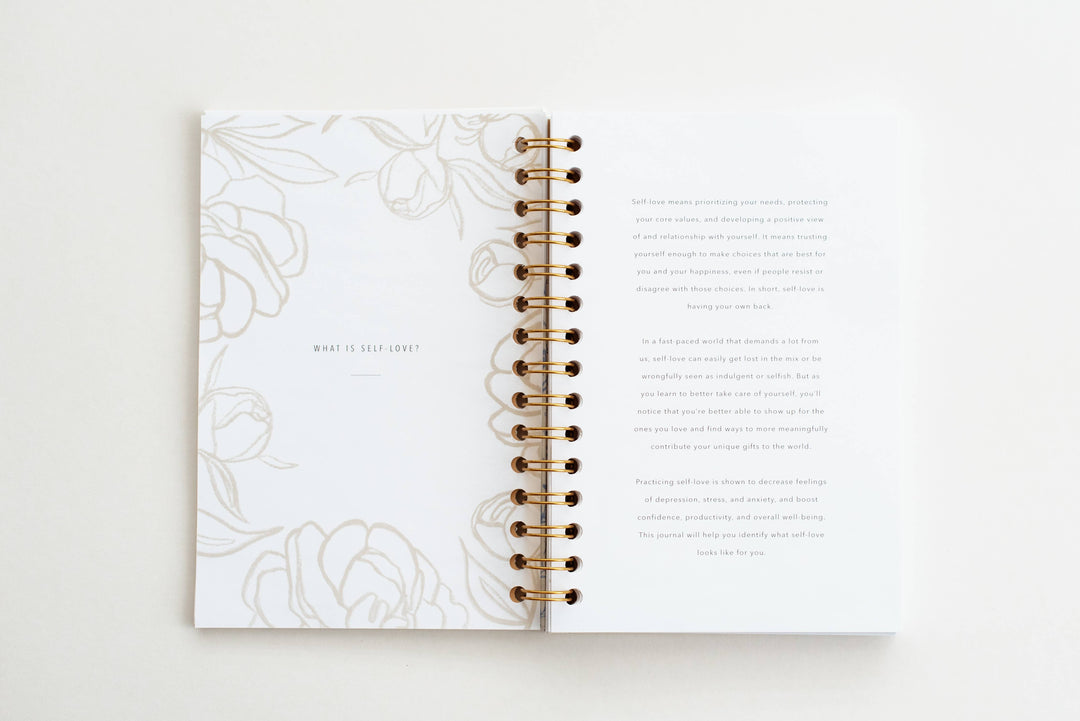 Open planner with floral design on a white background