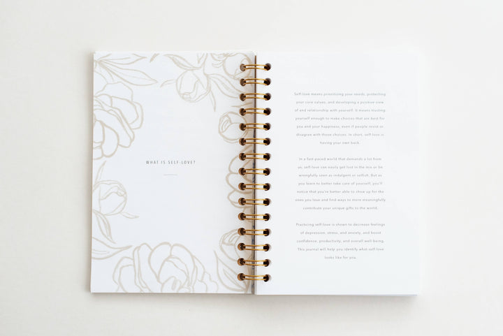 Open planner with floral design on a white background