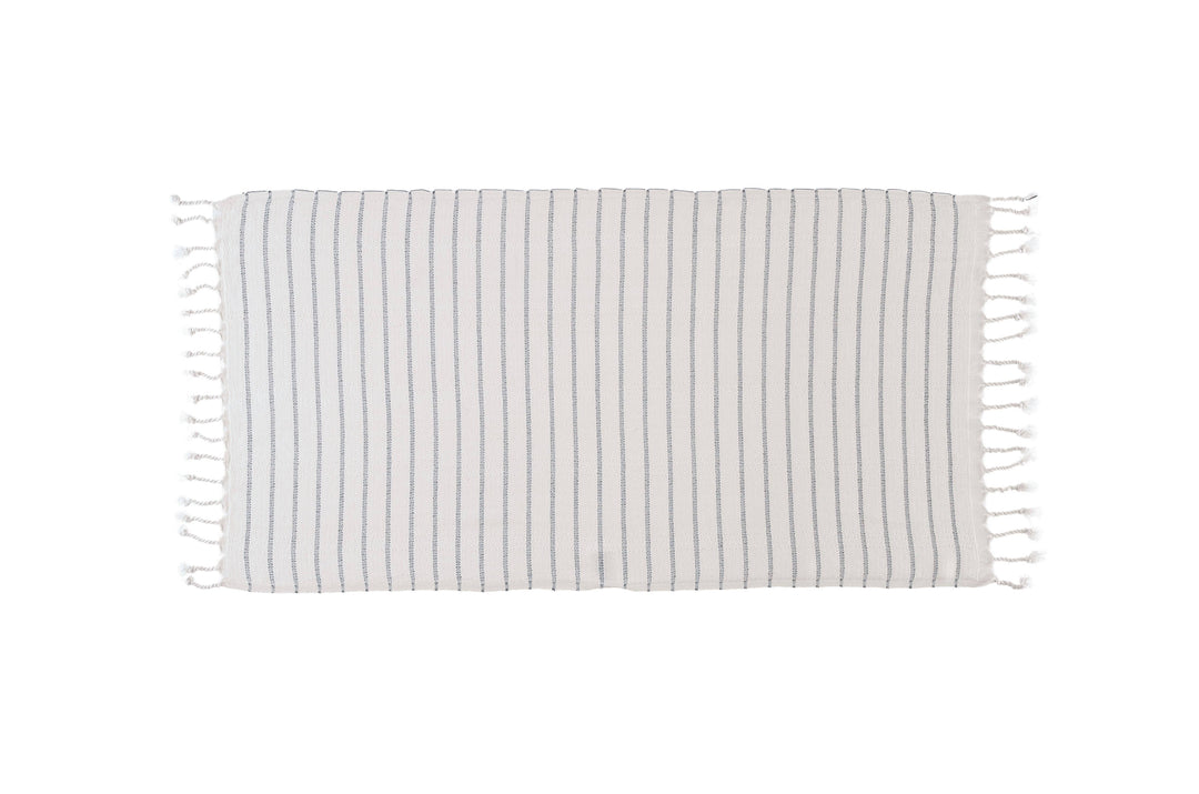 Striped towel with tassels on a white background