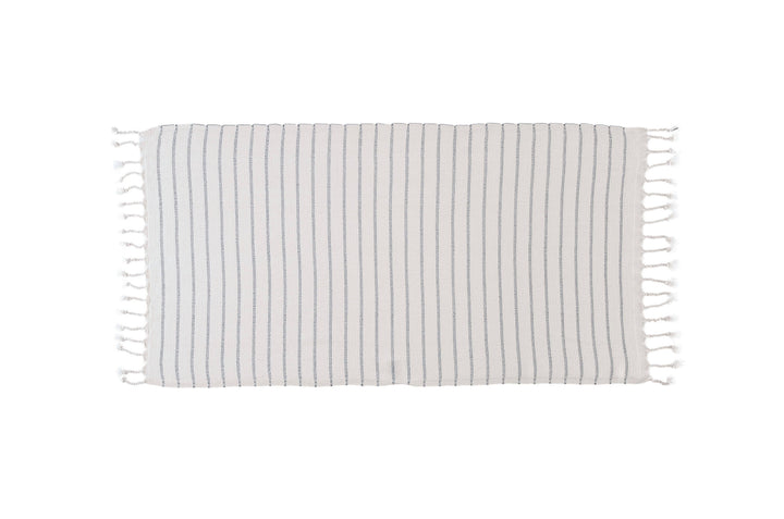Striped towel with tassels on a white background