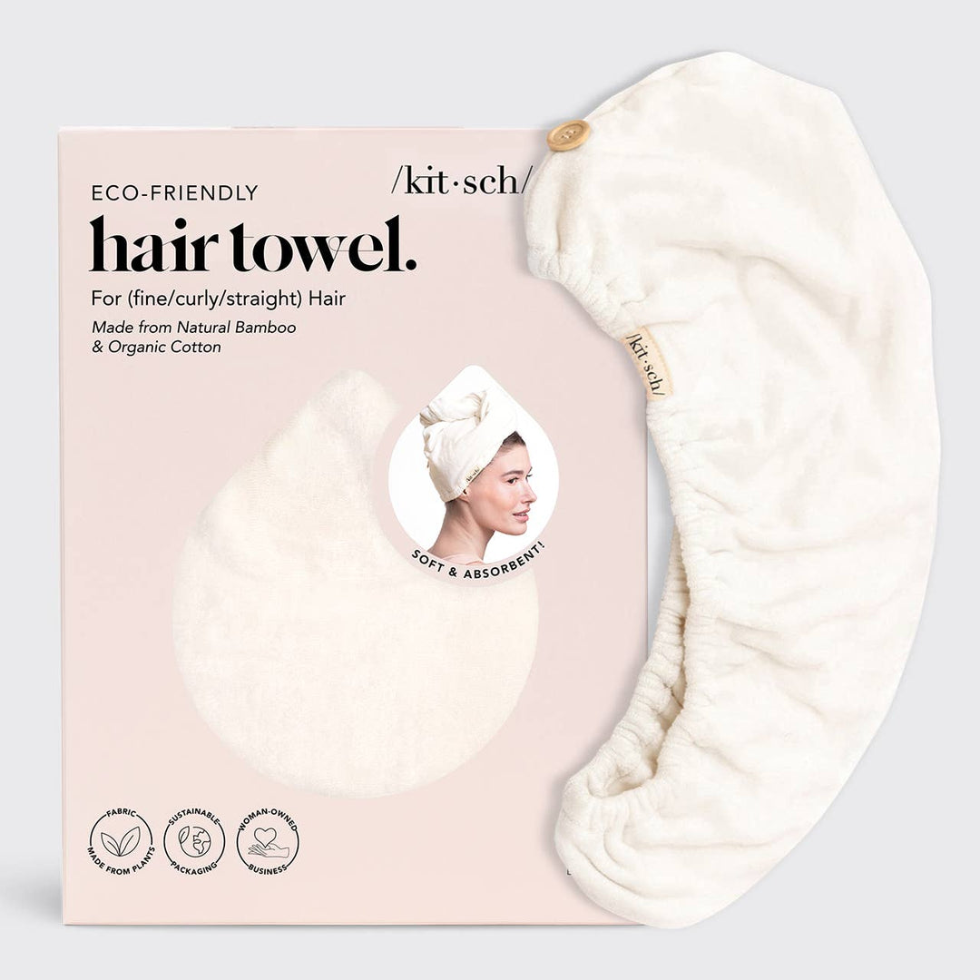 An ivory Kitsch eco-friendly hair towel made from natural bamboo and organic cotton, displayed with its packaging that states it's for fine/curly straight hair.