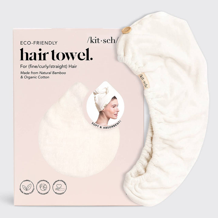 An ivory Kitsch eco-friendly hair towel made from natural bamboo and organic cotton, displayed with its packaging that states it&