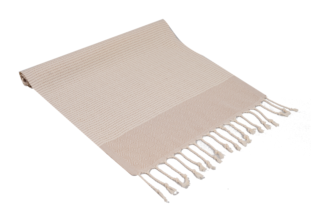 Beige woven blanket with fringes on a white background