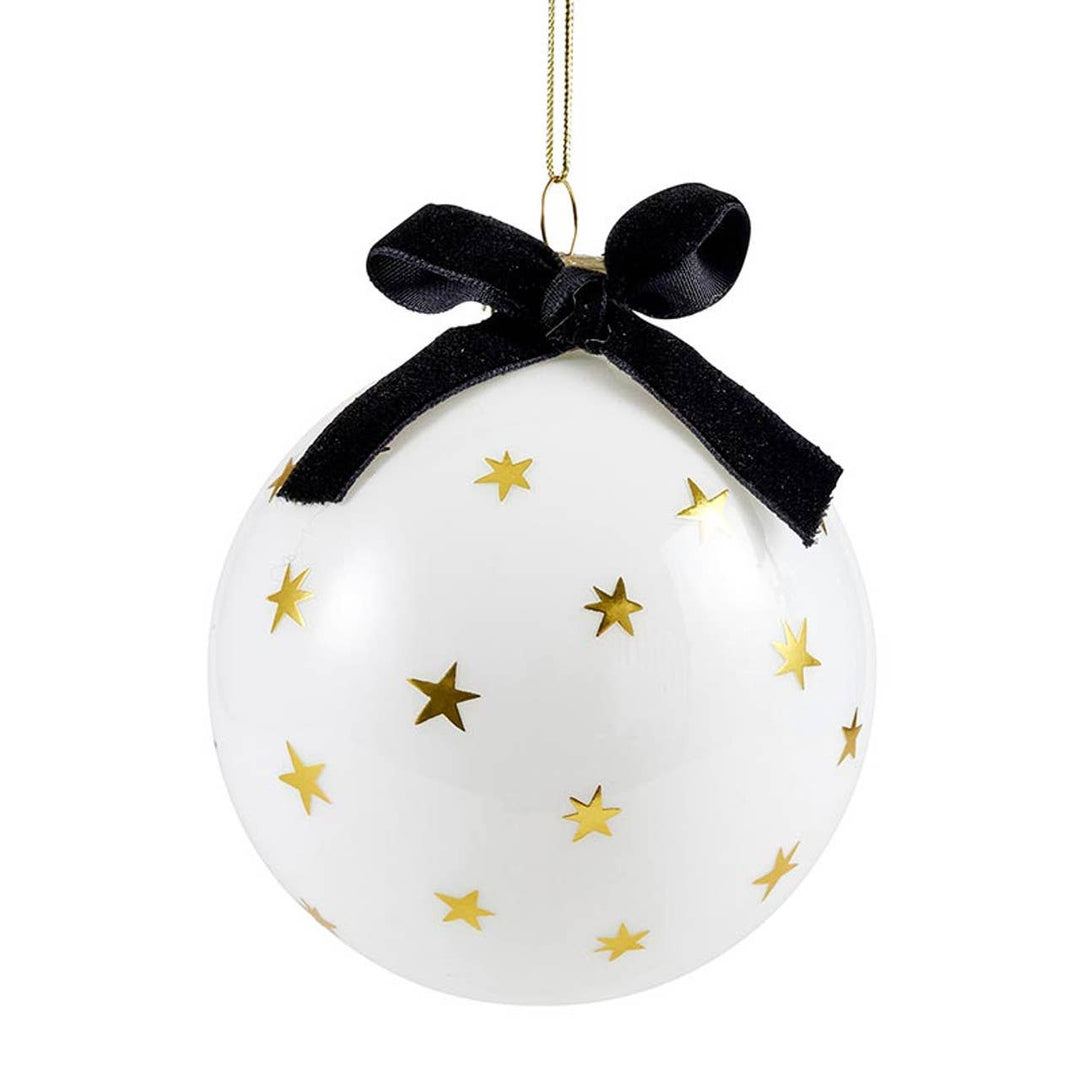 White ornament with gold stars and a black ribbon on a white background