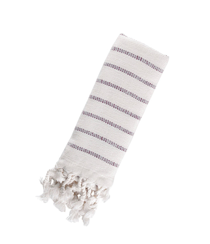 Striped towel with tassels on a white background