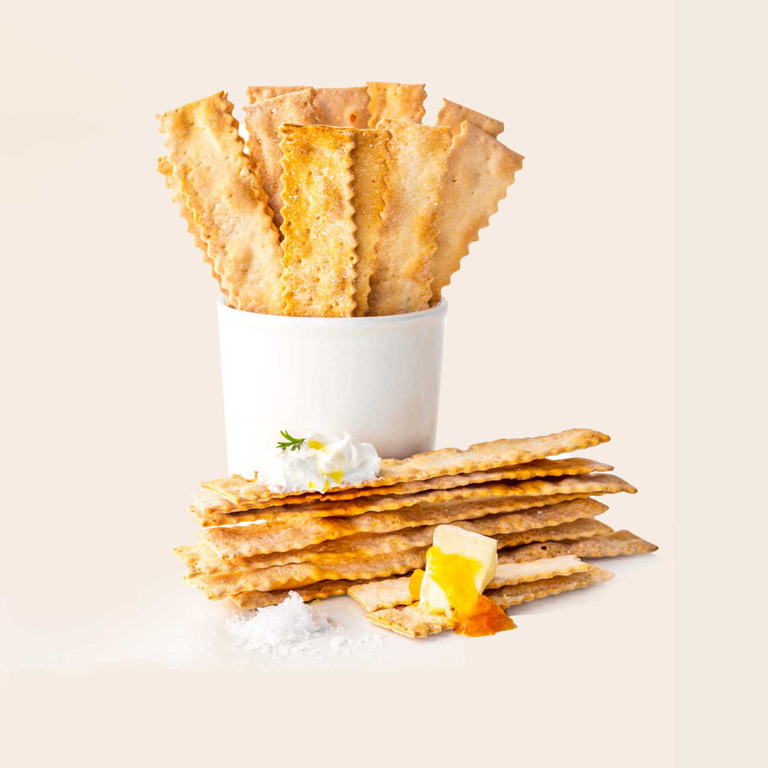 Stack of crackers with a small container.