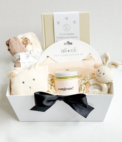 Celebrate life’s most precious moments with the Timeless Beginnings Newborn Essentials Gift Basket—a thoughtfully curated collection of heirloom-quality keepsakes and practical essentials for modern parents. Designed in neutral, gender-free tones, this luxury gift set combines meaningful memory-keeping with everyday functionality, making it the perfect baby shower gift, welcome-to-the-world present, or first birthday keepsake.