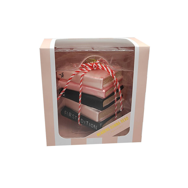 Book ornament in a decorative box with string, on a white background