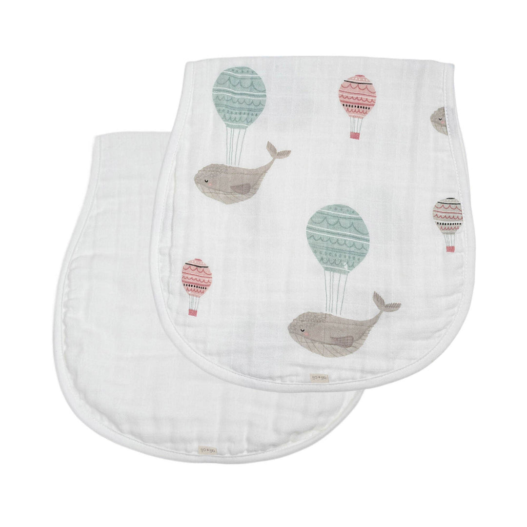 Two baby cloths with whale and hot air balloon pattern on a white background