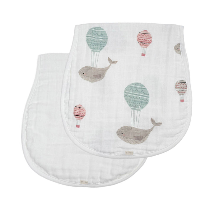 Two baby cloths with whale and hot air balloon pattern on a white background