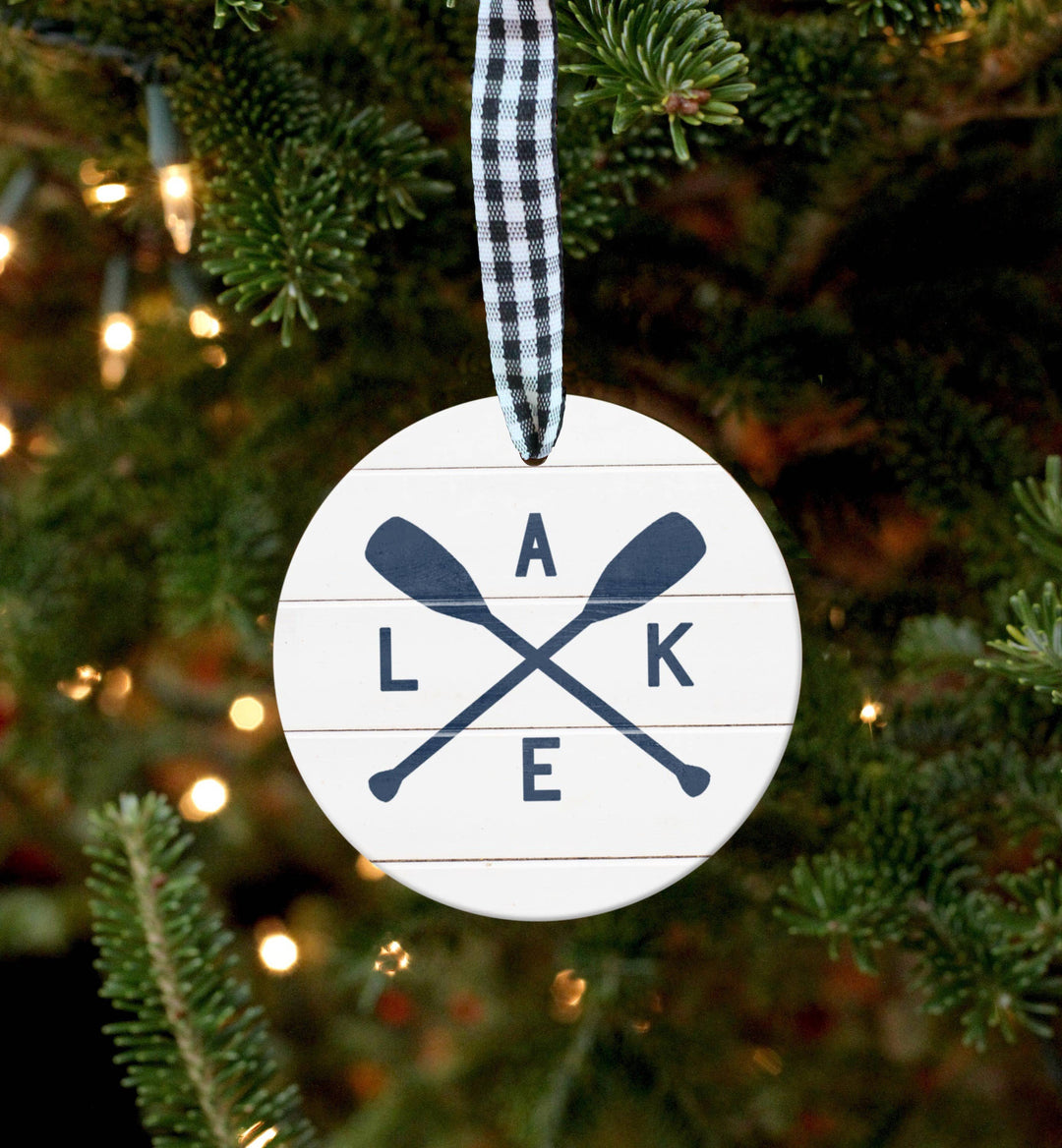 Decorative ornament with 'Lake' and crossed paddles on a Christmas tree.