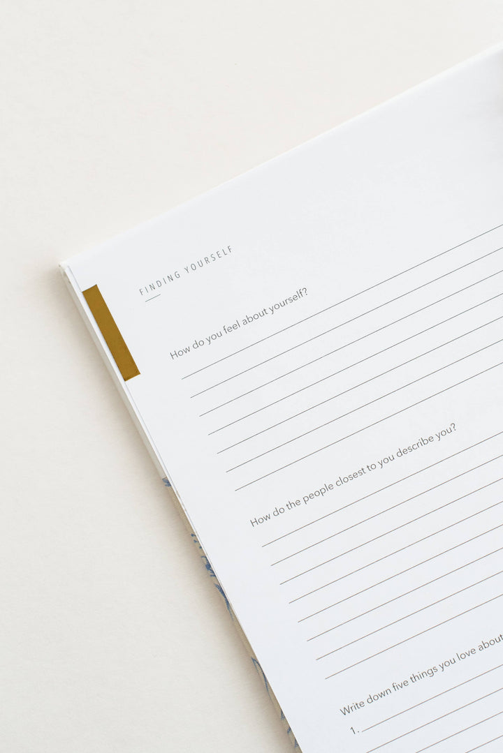 Open notebook with questionnaire on a white background