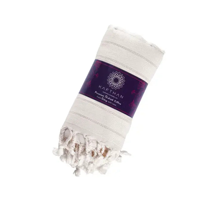 White towel with purple label on a white background
