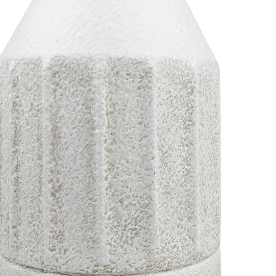 Textured white ceramic vase on a white background