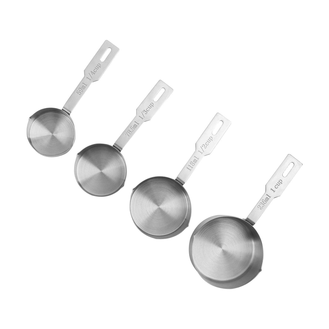 4 different sizes of stainless steel measuring cups on a white surface. 