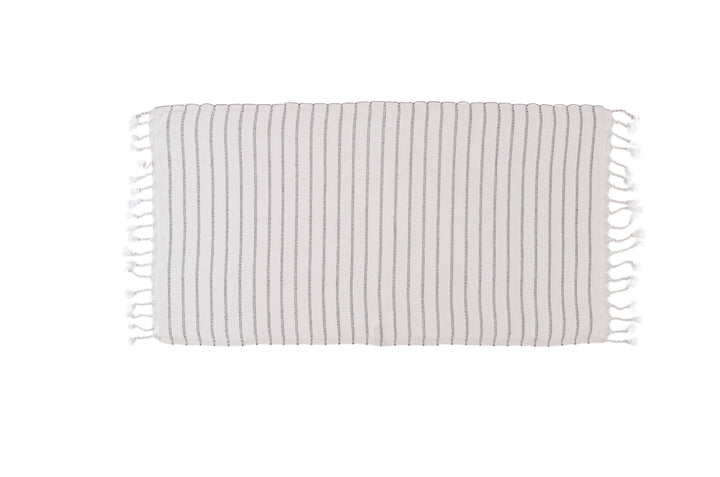 Striped towel with fringes on a white background