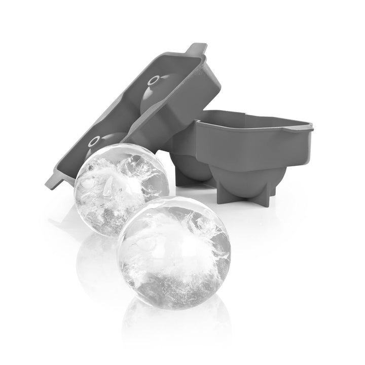 Gray silicone ice cube tray with two formed ice cubes on a white background