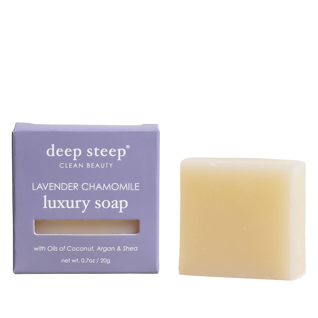 Luxury bar of soap next to its packaging labeled 'deep steep' on a white background