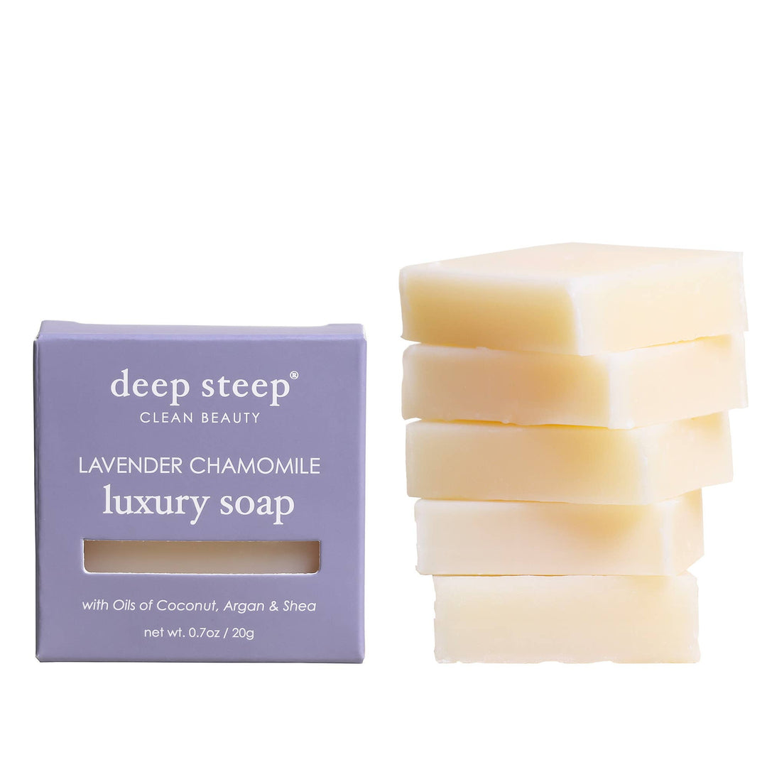 Stack of lavender chamomile luxury soap bars with packaging on a white background