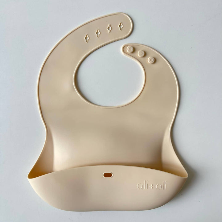 Silicone Baby Bib Roll Up &amp; Stay Closed - (Sand)