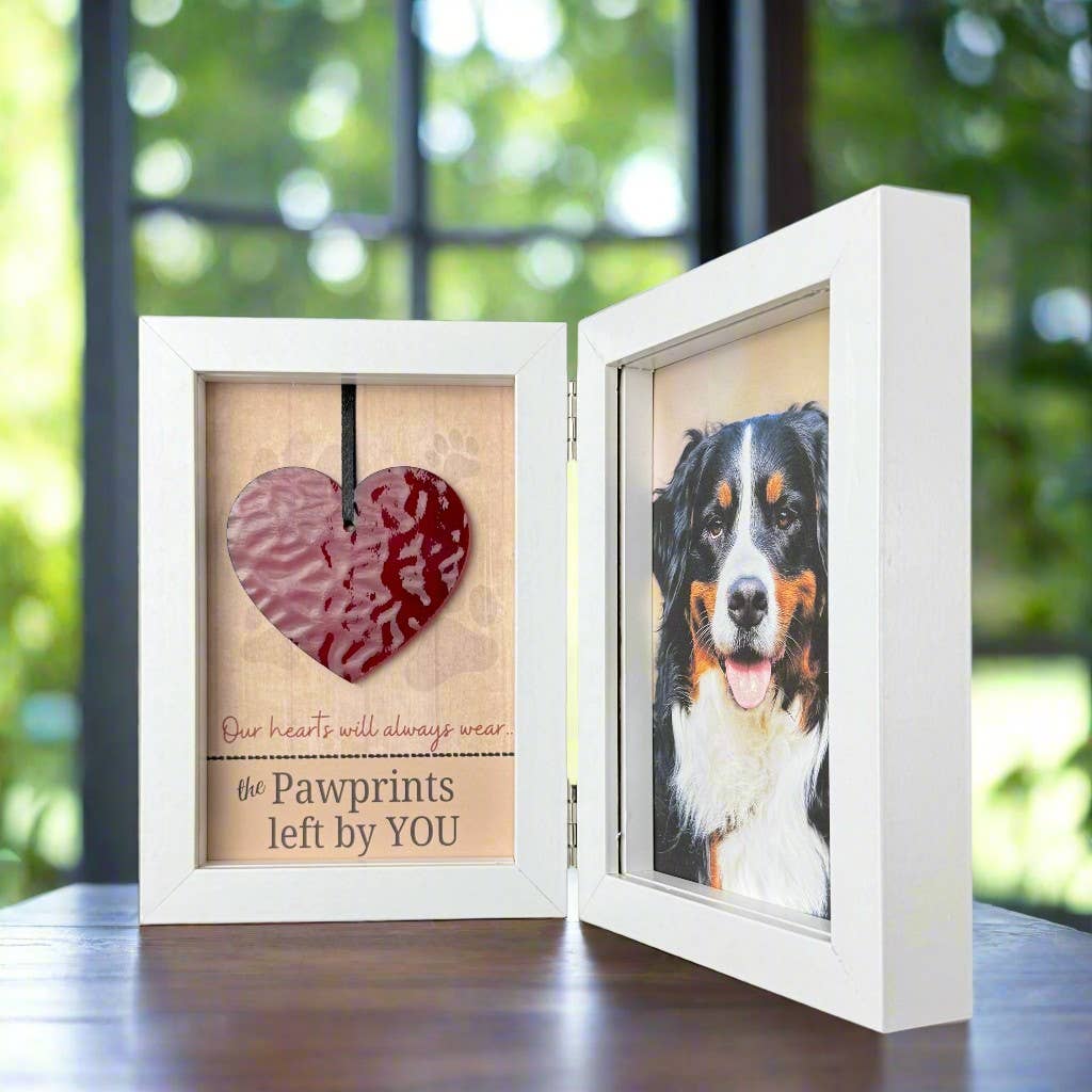 Two white picture frames with one containing a heart and the other a dog&