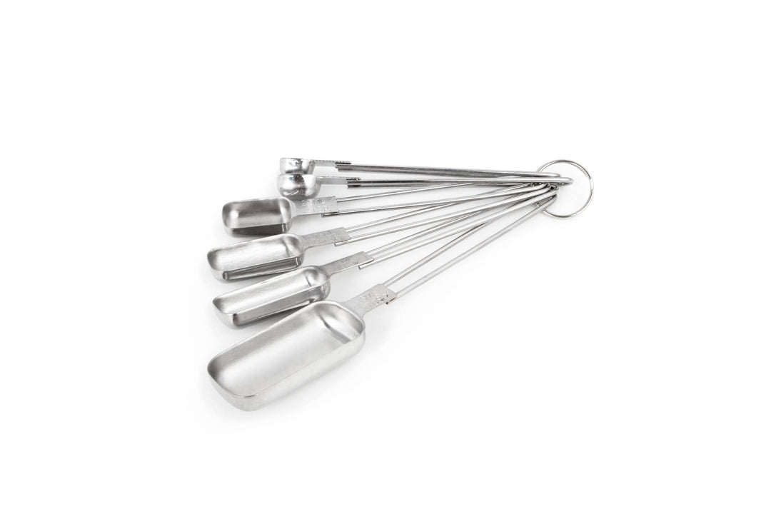 A set of six stainless steel measuring spoons in different sizes, attached together with a ring.