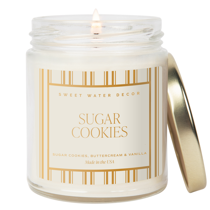 Candle in a glass jar with a gold lid and &