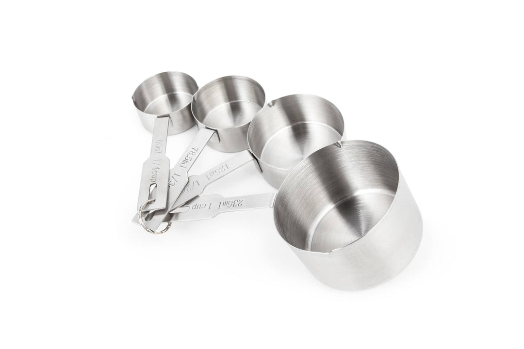 Four different sizes of stainless steel measuring cups connected by a ring on a white background. 