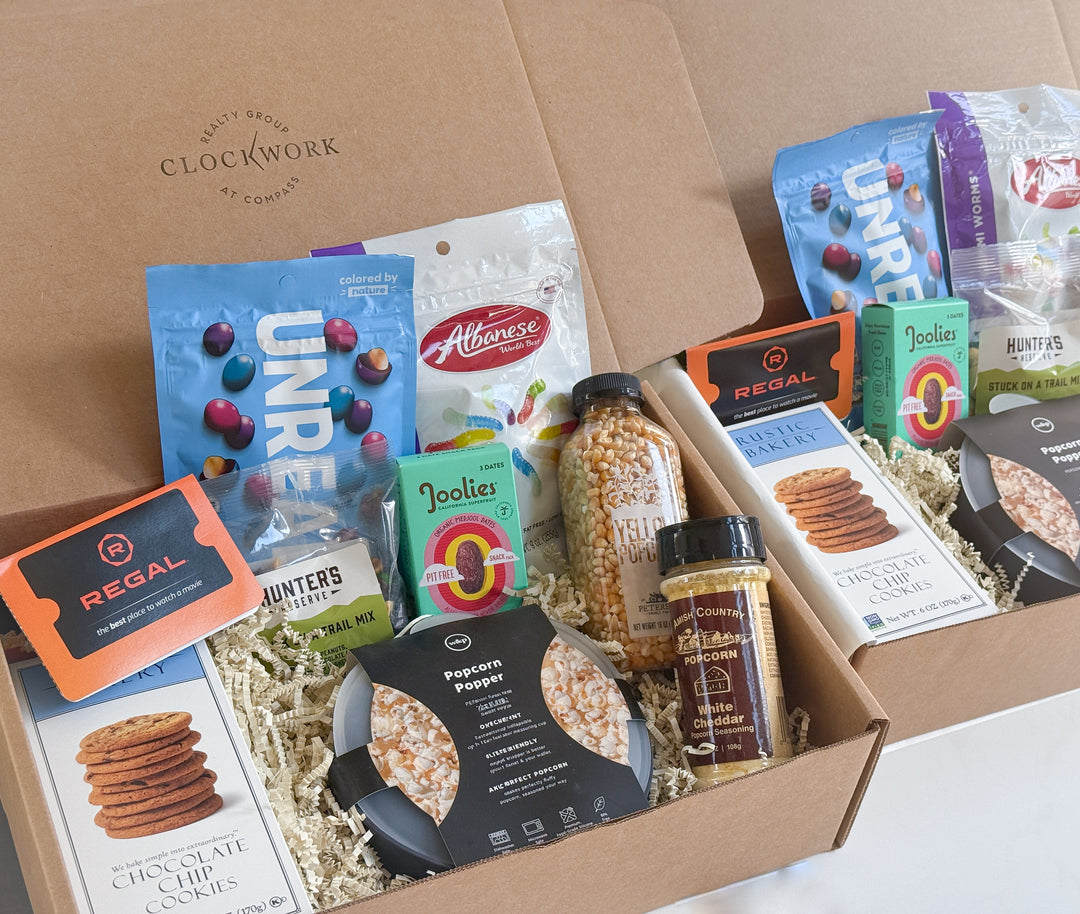 Open box containing various snack items in branded packaging