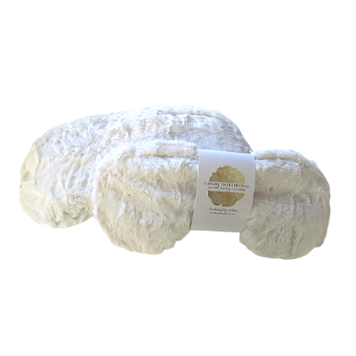 White fur eye mask wrapped in brand label. 