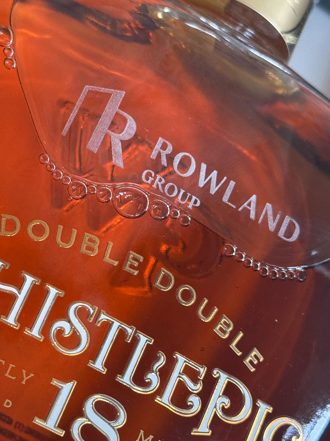 Close-up of a bottle label with &