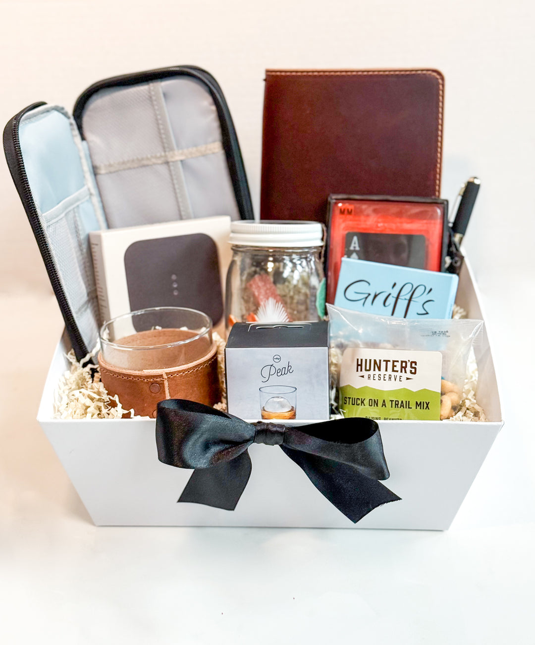 For the man who appreciates refined simplicity and functional luxury, our Modern Gentleman’s Essentials Collection is a thoughtfully curated gift set designed to elevate everyday moments—whether at work, home, or on the go. Presented in a crisp white basket with elegant shrink wrap and satin bow, this bundle blends premium practicality with understated sophistication.
