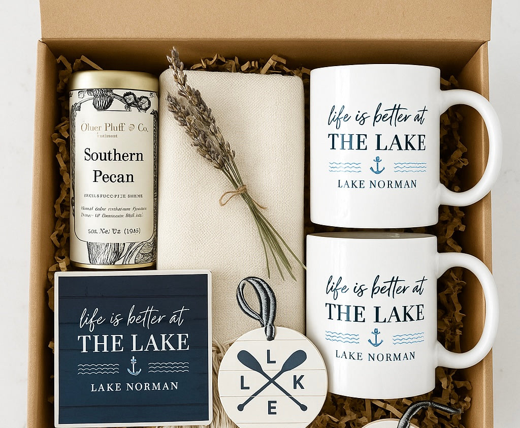Gift set with Lake Norman mugs, Southern Pecan tea, a towel and various lake themed decor items 