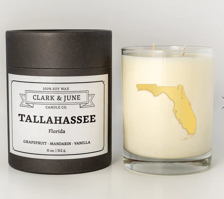 Candle with a map of Florida and packaging labeled &
