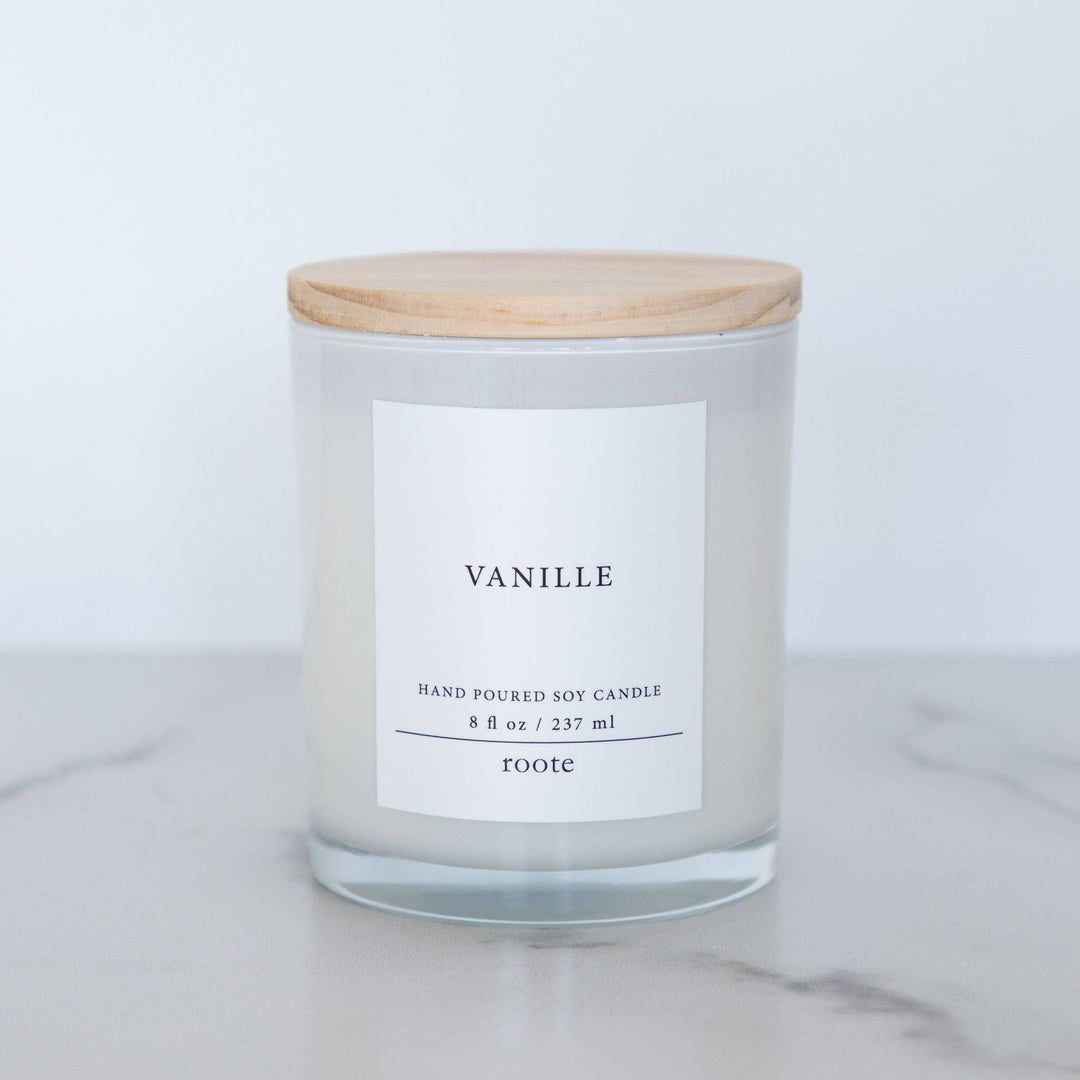 Candle with a wooden lid labeled &