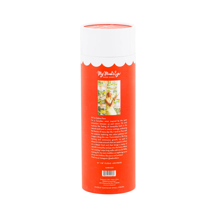 Cylindrical product packaging with a white top and red body on a white background