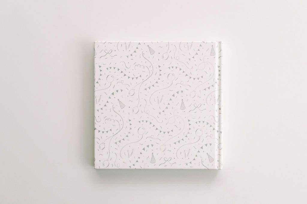 White textured square book on a light gray background