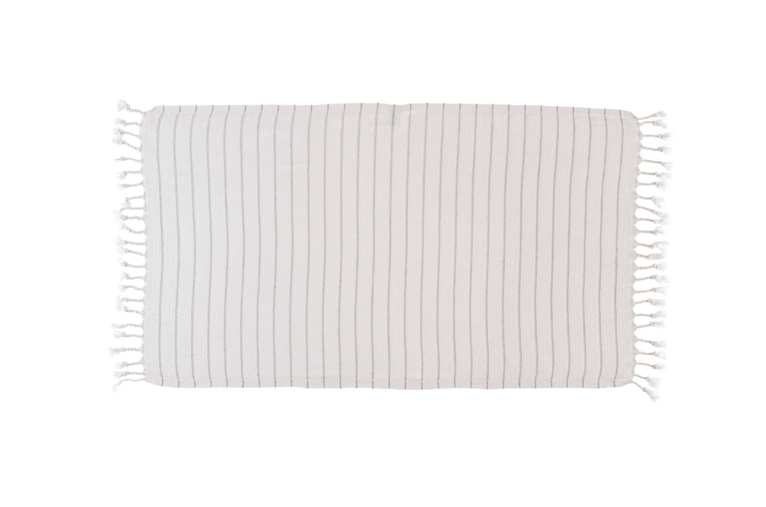 Striped blanket with tassels on a white background