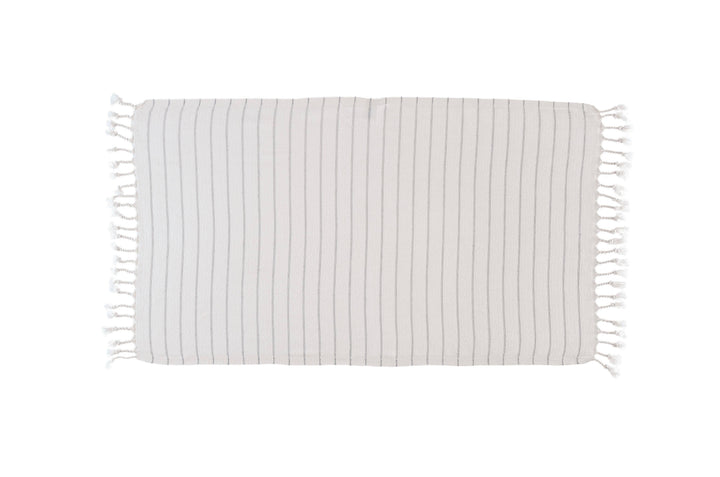 Striped blanket with tassels on a white background