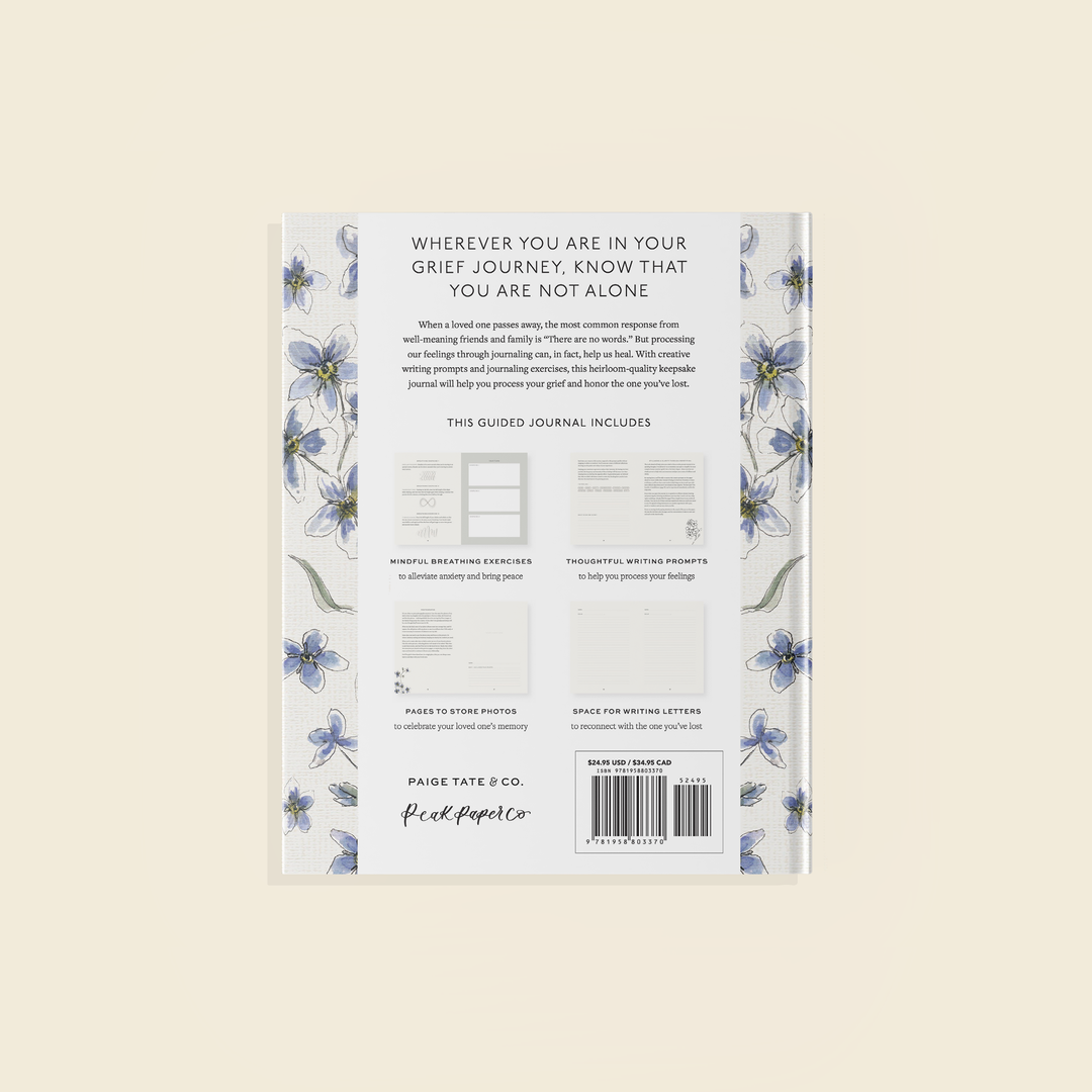 Back cover of a guided journal with floral design and text on a beige background