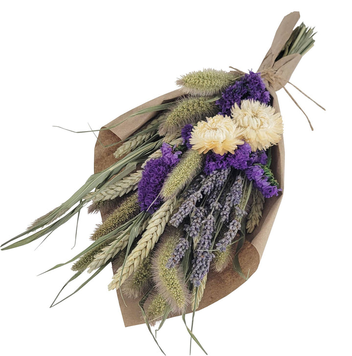 A petite bouquet featuring a mix of natural strawflowers, lavender, and grains, bound and arranged in a rustic style.