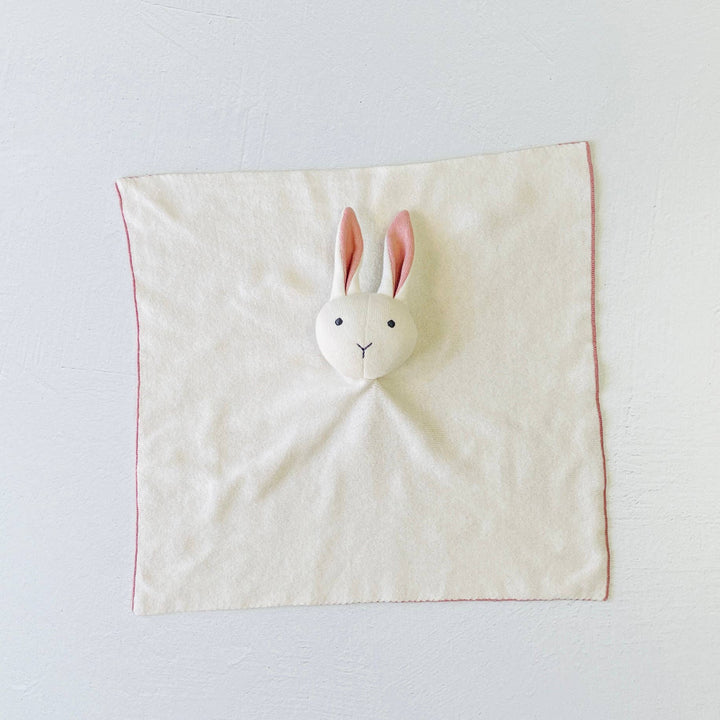 Fabric square with a rabbit plush head on a light gray background